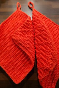 handmade red crochet oven mitts wool material